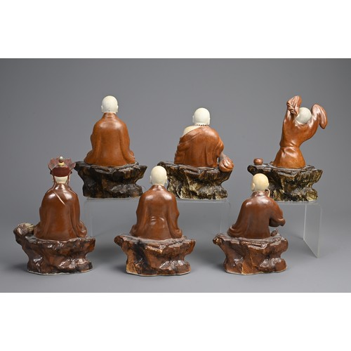 41 - A RARE SET OF CHINESE PAINTED AND ENAMELLED BISCUIT PORCELAIN LUOHAN FIGURES, ATTRIBUTED TO ZENG LON... 