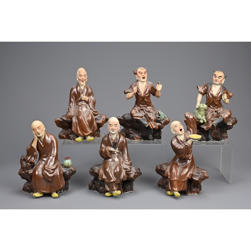 41 - A RARE SET OF CHINESE PAINTED AND ENAMELLED BISCUIT PORCELAIN LUOHAN FIGURES, ATTRIBUTED TO ZENG LON... 