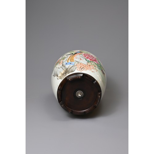 160 - A CHINESE PORCELAIN OVIFORM FAMILLE ROSE VASE. Painted with a pheasant and crane, before a peony and... 