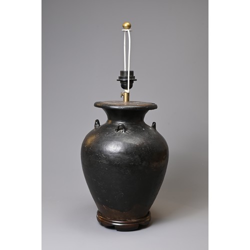 156 - A CHINESE BLACK GLAZED STONEWARE OVIFORM VASE ADAPTED AS A LAMP. With everted rim and lug handles, o... 