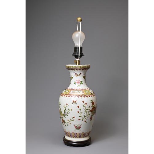 154 - A 20TH CENTURY CHINESE PORCELAIN OVIFORM FAMILLE ROSE VASE ADAPTED AS A LAMP. Painted with butterfli... 