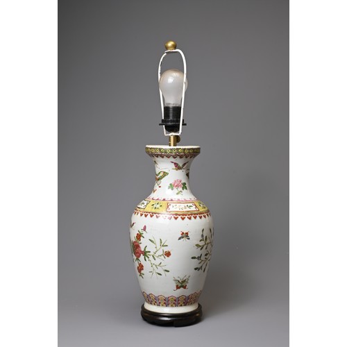 154 - A 20TH CENTURY CHINESE PORCELAIN OVIFORM FAMILLE ROSE VASE ADAPTED AS A LAMP. Painted with butterfli... 