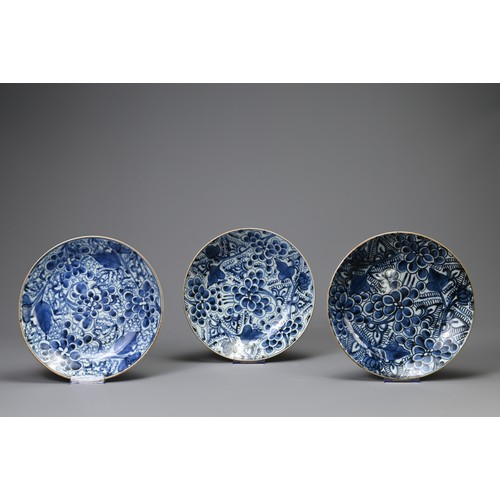 141 - THREE CHINESE PORCELAIN KANGXI (1661-1722) BLUE AND WHITE PEONY PATTERN DISHES, each with seal mark,... 