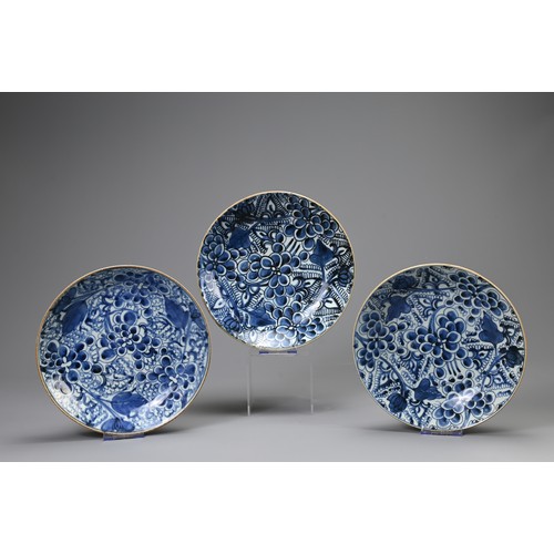 141 - THREE CHINESE PORCELAIN KANGXI (1661-1722) BLUE AND WHITE PEONY PATTERN DISHES, each with seal mark,... 