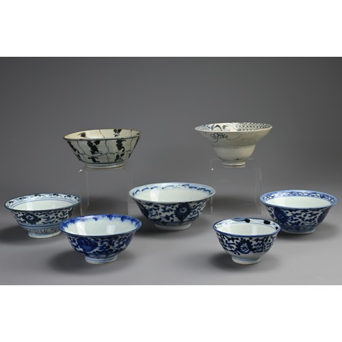 146 - A COLLECTION OF SEVEN CHINESE PORCELAIN BLUE AND WHITE BOWLS. The first probably Ming Dynasty, with ... 