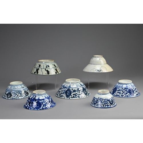 146 - A COLLECTION OF SEVEN CHINESE PORCELAIN BLUE AND WHITE BOWLS. The first probably Ming Dynasty, with ... 