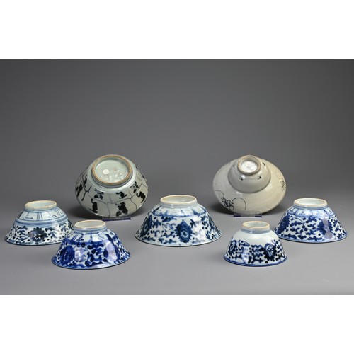 146 - A COLLECTION OF SEVEN CHINESE PORCELAIN BLUE AND WHITE BOWLS. The first probably Ming Dynasty, with ... 