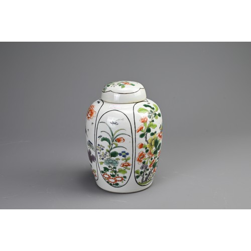 100 - A CHINESE FAMILLE VERTE PORCELAIN JAR AND COVER, EARLY 20TH CENTURY. Of ovoid form decorated with pa... 