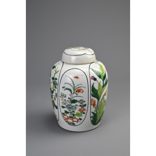 100 - A CHINESE FAMILLE VERTE PORCELAIN JAR AND COVER, EARLY 20TH CENTURY. Of ovoid form decorated with pa... 