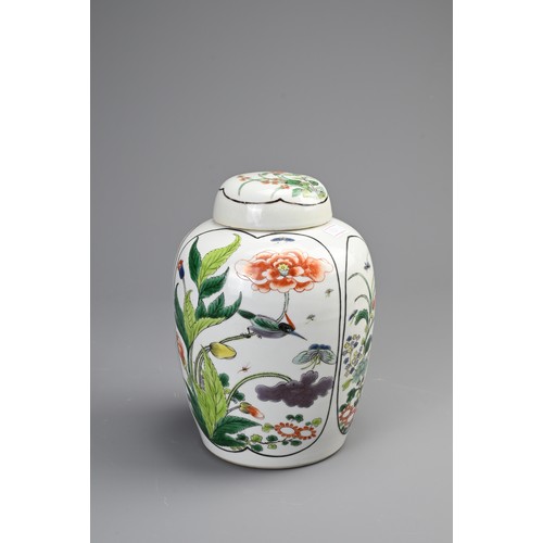 100 - A CHINESE FAMILLE VERTE PORCELAIN JAR AND COVER, EARLY 20TH CENTURY. Of ovoid form decorated with pa... 