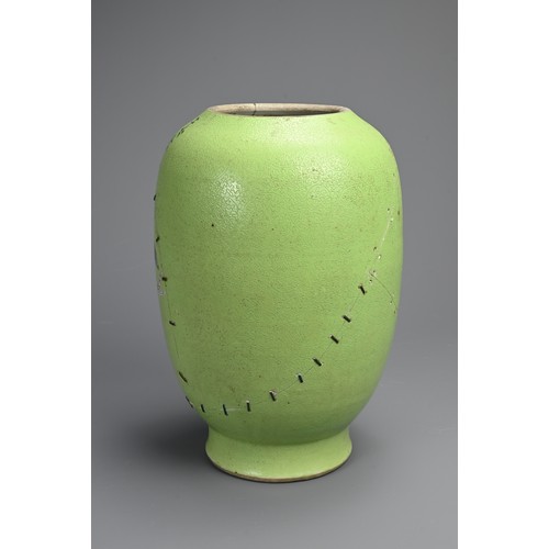 102 - A CHINESE FAMILLE ROSE LIME GREEN GROUND SGRAFFITO VASE, 19TH CENTURY. Lantern form decorated with l... 