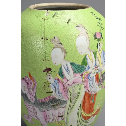 102 - A CHINESE FAMILLE ROSE LIME GREEN GROUND SGRAFFITO VASE, 19TH CENTURY. Lantern form decorated with l... 