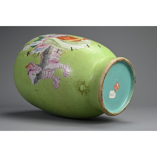 102 - A CHINESE FAMILLE ROSE LIME GREEN GROUND SGRAFFITO VASE, 19TH CENTURY. Lantern form decorated with l... 