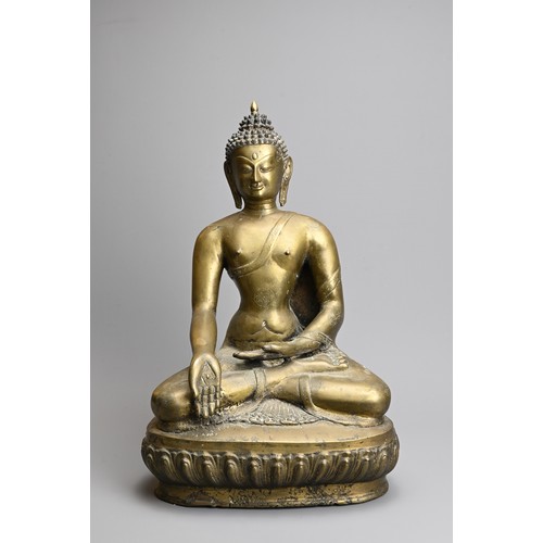 204 - A TIBETAN CAST BRONZE FIGURE OF SHAKYAMUNI, 20TH CENTURY. Seated on a lotus base dressed in robes de... 