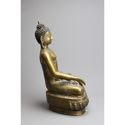 204 - A TIBETAN CAST BRONZE FIGURE OF SHAKYAMUNI, 20TH CENTURY. Seated on a lotus base dressed in robes de... 