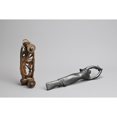 210 - TWO SOUTH EAST ASIAN CAST METAL ITEMS OF DOOR FURNITURE. Comprising: a door handle in the form of a ... 