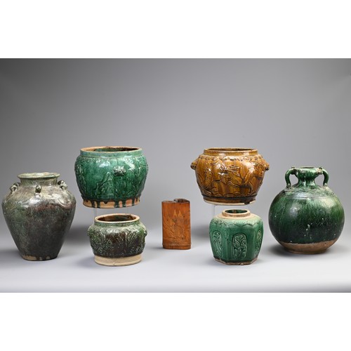 187 - A GROUP OF CHINESE GREEN AND OCHRE GLAZED STORAGE JARS AND A BAMBOO BRUSH POT. Comprising: a green g... 