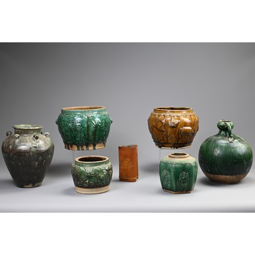 187 - A GROUP OF CHINESE GREEN AND OCHRE GLAZED STORAGE JARS AND A BAMBOO BRUSH POT. Comprising: a green g... 