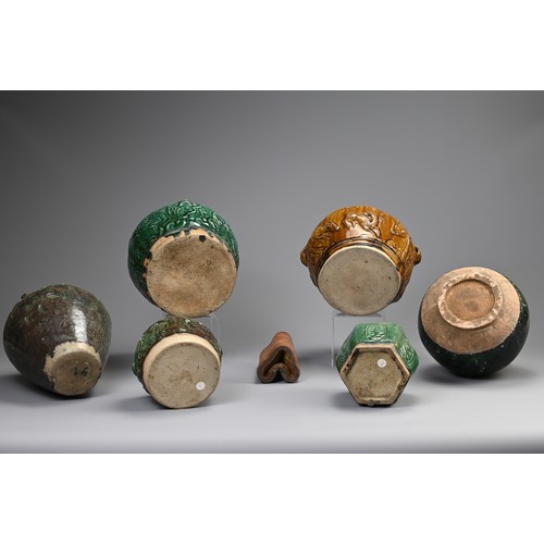 187 - A GROUP OF CHINESE GREEN AND OCHRE GLAZED STORAGE JARS AND A BAMBOO BRUSH POT. Comprising: a green g... 