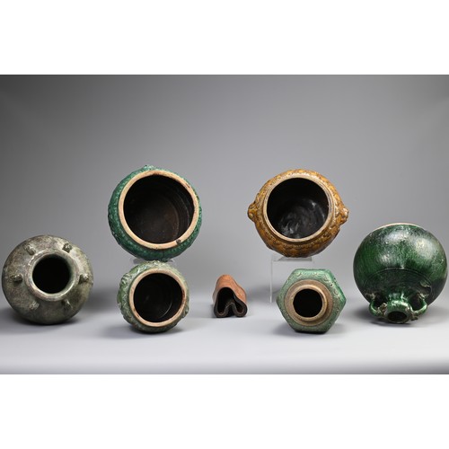 187 - A GROUP OF CHINESE GREEN AND OCHRE GLAZED STORAGE JARS AND A BAMBOO BRUSH POT. Comprising: a green g... 