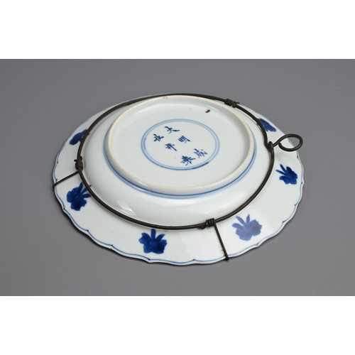 78 - A CHINESE BLUE AND WHITE PORCELAIN DISH, 18TH CENTURY. Of lobed form decorated with lotus motifs. Wi... 