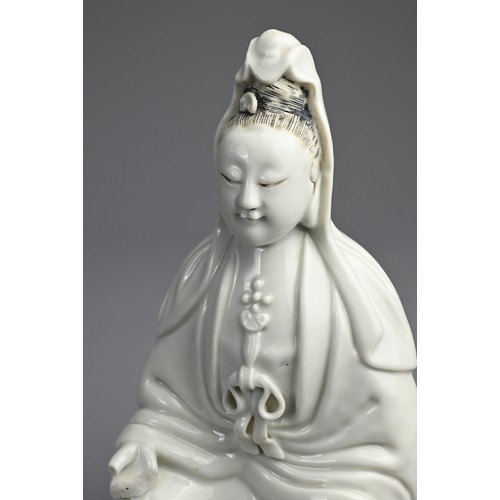 80 - A CHINESE DEHUA PORCELAIN FIGURE OF GUANYIN, 19TH CENTURY. Seated, dressed in long robes with hair t... 