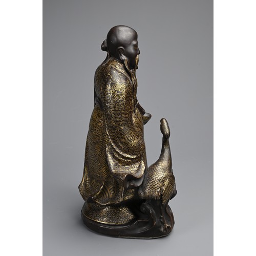 85 - A CHINESE BRONZE IMITATION PORCELAIN FIGURE OF SHOULAO, YOU CHANGZI (1874-1922). The brown glazed an... 