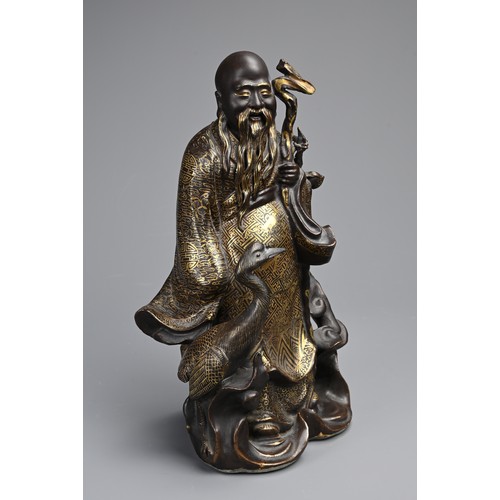 85 - A CHINESE BRONZE IMITATION PORCELAIN FIGURE OF SHOULAO, YOU CHANGZI (1874-1922). The brown glazed an... 