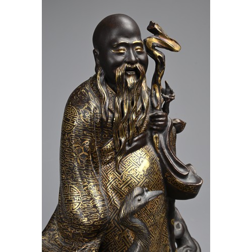 85 - A CHINESE BRONZE IMITATION PORCELAIN FIGURE OF SHOULAO, YOU CHANGZI (1874-1922). The brown glazed an... 