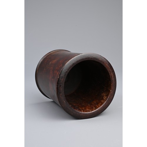 91 - A CHINESE HUANGHUALI BRUSH POT, BITONG, QING DYNASTY. Very slightly waisted cylindrical form with ca... 