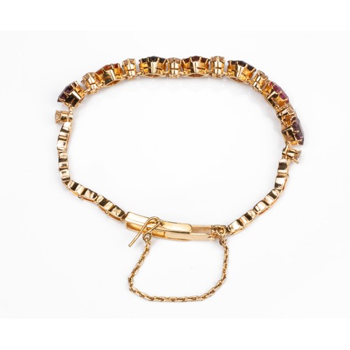 52 - A YELLOW GOLD AND MULTICOLOURED GEM AND DIAMOND BRACELET, MID 20TH CENTURY. Fourteen round cut diamo... 