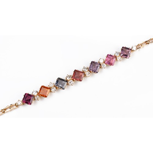 52 - A YELLOW GOLD AND MULTICOLOURED GEM AND DIAMOND BRACELET, MID 20TH CENTURY. Fourteen round cut diamo... 