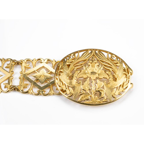 53 - A HEAVY HIGH CARAT PERANAKAN YELLOW GOLD BELT, MID 20TH CENTURY. Twenty three links with a pierced p... 