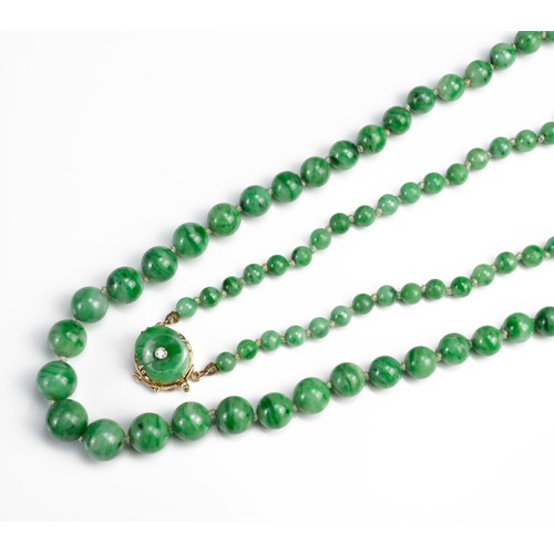 57 - A GRADUATED JADE BEAD NECKLACE WITH 14CT GOLD CLASP WITH SINGLE DIAMOND. Marked 14K. Length 76cm. Be... 