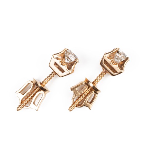 43 - A PAIR OF HIGH CARAT ROSE GOLD DIAMOND STUD EARRINGS, MID 20TH CENTURY. Single round cut diamonds in... 