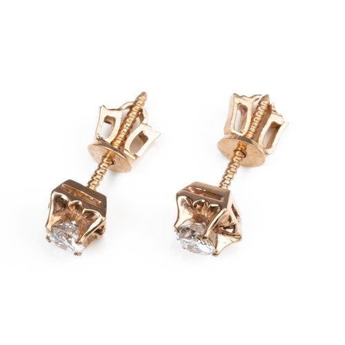 43 - A PAIR OF HIGH CARAT ROSE GOLD DIAMOND STUD EARRINGS, MID 20TH CENTURY. Single round cut diamonds in... 