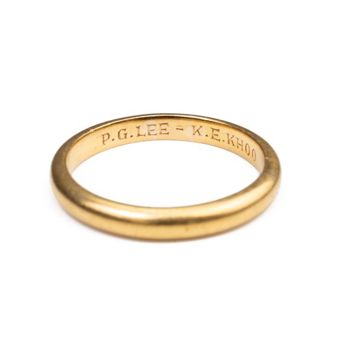 45 - A 22CT YELLOW GOLD BAND, MID 20TH CENTURY. Engraved P.G.LEE - K.E.KHOO. Stamped 22. Ring size P. Wei... 