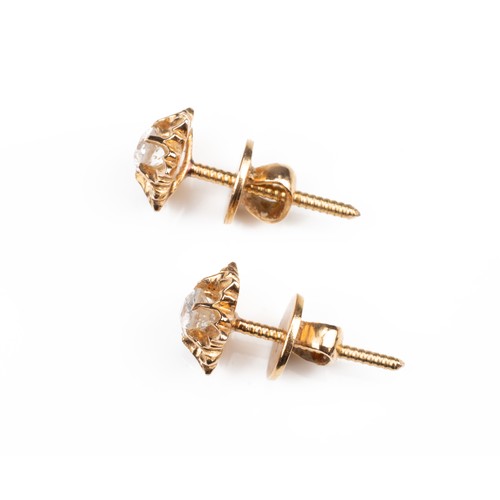 44 - A PAIR OF HIGH CARAT ROSE GOLD STUD DIAMOND EARRINGS, MID 20TH CENTURY. Single round cut diamonds mo... 