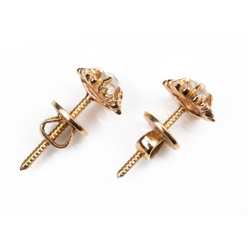 44 - A PAIR OF HIGH CARAT ROSE GOLD STUD DIAMOND EARRINGS, MID 20TH CENTURY. Single round cut diamonds mo... 