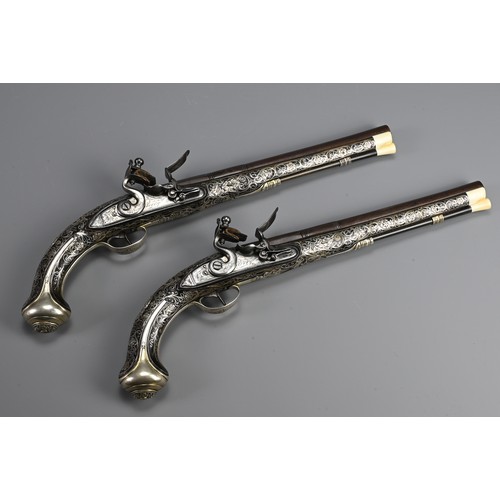 76 - A FINE PAIR OF SILVER INLAID FLINTLOCK PISTOLS BY PERRY, LONDON CIRCA 1780. Profusely inlaid with sc... 