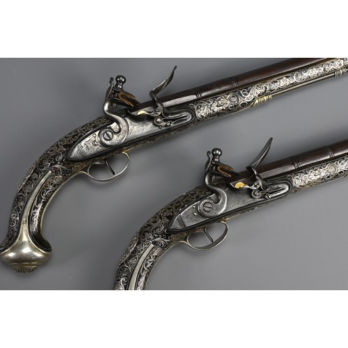 76 - A FINE PAIR OF SILVER INLAID FLINTLOCK PISTOLS BY PERRY, LONDON CIRCA 1780. Profusely inlaid with sc... 