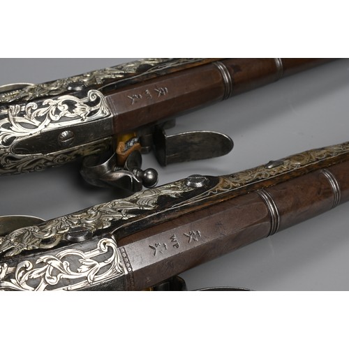 76 - A FINE PAIR OF SILVER INLAID FLINTLOCK PISTOLS BY PERRY, LONDON CIRCA 1780. Profusely inlaid with sc... 