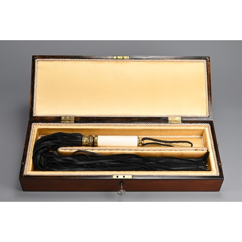 77 - AN ENGLISH REGENCY BOX WITH DISCIPLINE LEATHER WHIP SCOURGE. Rectangular mahogany box with bronze ha... 