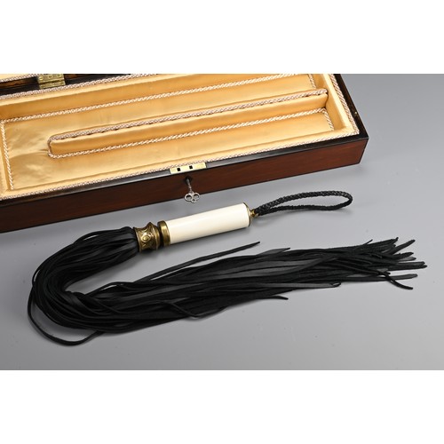 77 - AN ENGLISH REGENCY BOX WITH DISCIPLINE LEATHER WHIP SCOURGE. Rectangular mahogany box with bronze ha... 