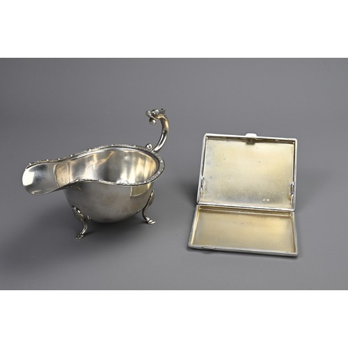 73 - A MAPPIN AND WEBB SILVER GRAVY BOAT AND CIGARETTE CASE, EARLY 20TH CENTURY. The gravy boat of Celtic... 