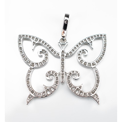 65 - AN 18CT WHITE GOLD AND DIAMOND OPENWORK BUTTERFLY PENDANT WITH INSURANCE VALUATION. Made up of 124 r... 