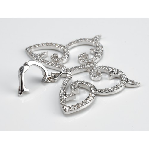 65 - AN 18CT WHITE GOLD AND DIAMOND OPENWORK BUTTERFLY PENDANT WITH INSURANCE VALUATION. Made up of 124 r... 