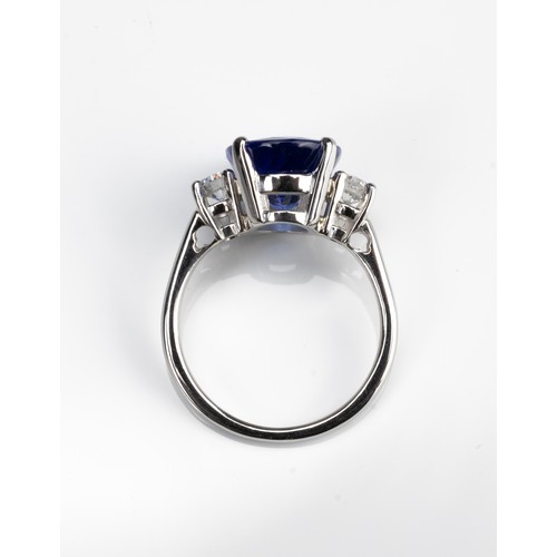 70 - A 5.71CT TANZANITE AND DIAMOND PLATINUM RING WITH INSURANCE VALUATION. A high clarity deep purplish ... 