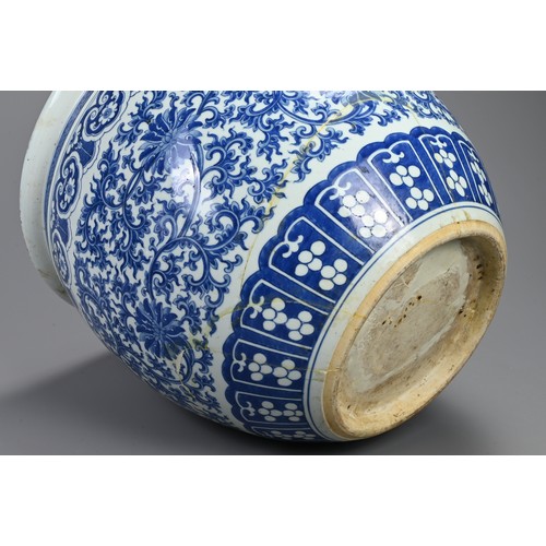 94 - A LARGE 19TH CENTURY CHINESE PORCELAIN BLUE AND JARDINIERE. Painted in the Ming style with lotus, tr... 