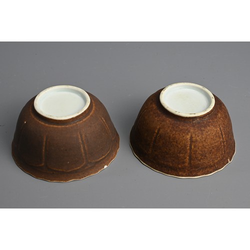 139 - A PAIR OF CHINESE KANGXI (1662-1722) CAFE-AU-LAIT GROUND SHIPWRECK TEABOWLS AND SAUCERS. Each painte... 